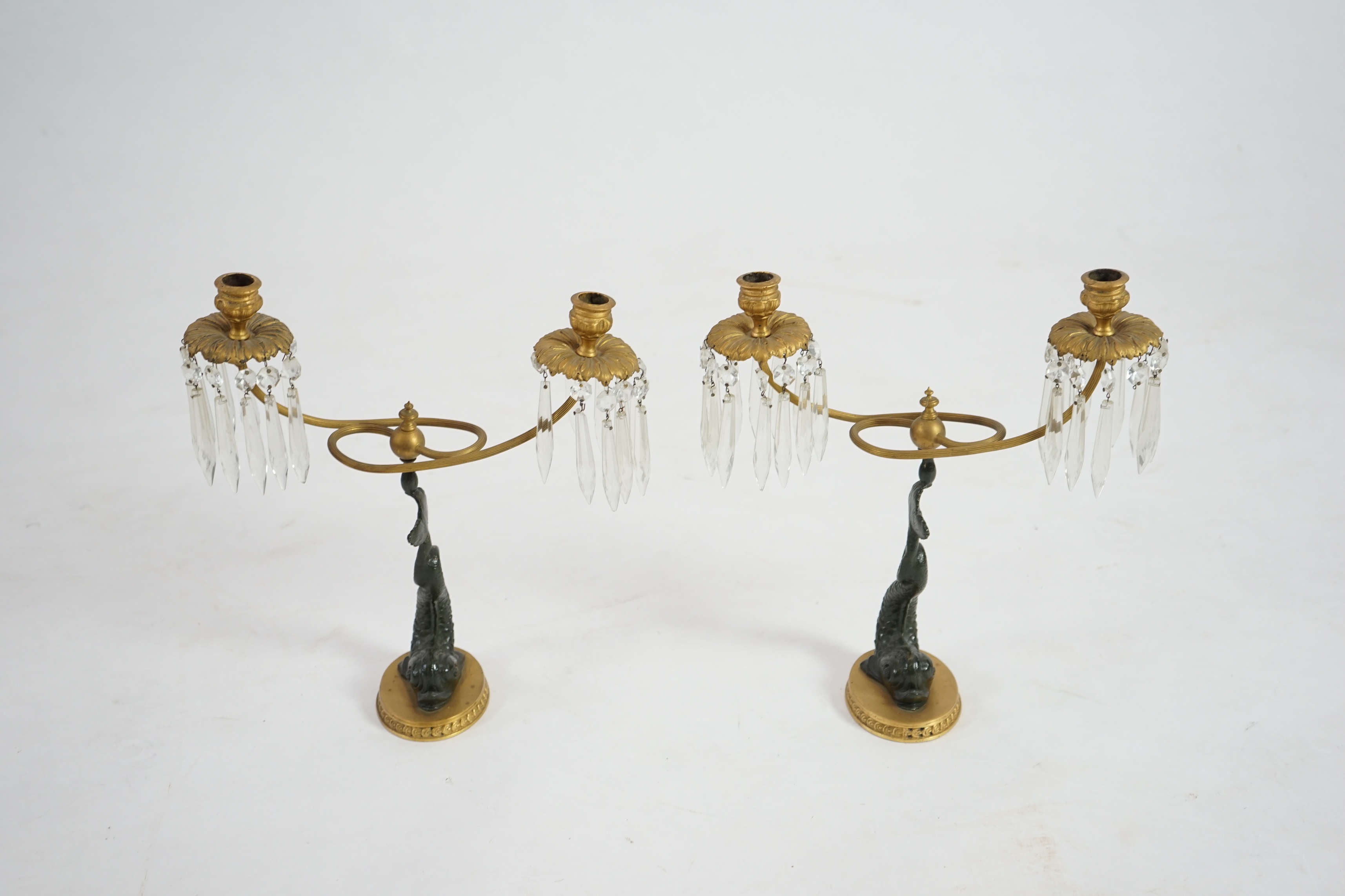 A pair of 19th century bronze and ormolu twin sconce candelabra